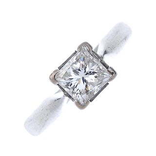 An 18ct gold diamond single-stone ring. The square-shape diamond, to the plain band. Diamond chipped