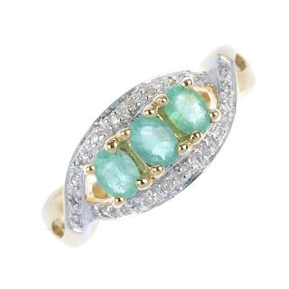 A 9ct gold emerald and diamond dress ring. The oval-shape emerald line, within a single-cut diamond