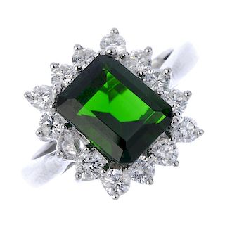 An 18ct gold tourmaline and diamond cluster ring. The rectangular-shape tourmaline, within a brillia