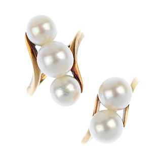 MIKIMOTO - two cultured pearl dress rings. The first designed as two cultured pearls to the asymmetr