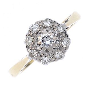 A mid 20th century 18ct gold diamond cluster ring. The brilliant-cut diamond, within a similarly-cut