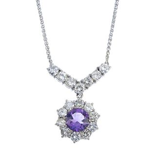 An 18ct gold amethyst and diamond necklace. The circular-shape amethyst and brilliant-cut diamond cl