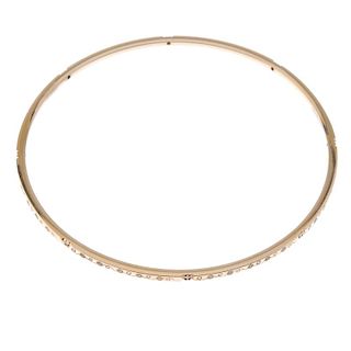 THEO FENNELL - an 18ct gold diamond bangle. The scrolling floral motif bangle, with brilliant-cut di
