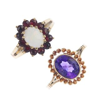 A selection of four 9ct gold gem-set rings. To include an opal and garnet cluster ring, an amethyst