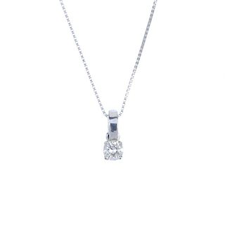 An 18ct gold diamond single-stone pendant. The brilliant-cut diamond, suspended from a plain bar sur