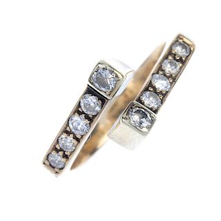 A diamond crossover ring. The angular band, with circular-cut diamond line sides and brilliant-cut d