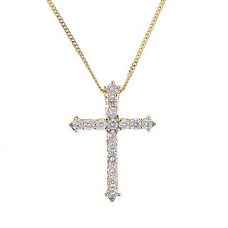 A diamond cross pendant. The brilliant-cut diamond cross, suspended from a 9ct gold flat curb-link c