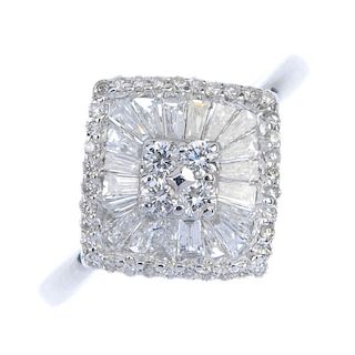 An 18ct gold diamond cluster ring. Of kite-shape outline, the brilliant-cut diamond quatrefoil, with