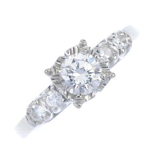 A diamond dress ring. The brilliant-cut diamond, within an illusion setting, to the single-cut diamo