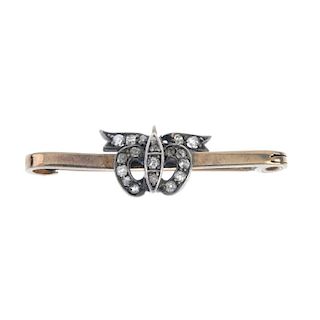 An early 20th century 9ct gold and silver diamond brooch. The single-cut diamond bow, to the plain b