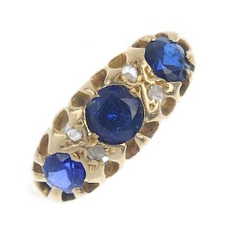 An Edwardian 18ct gold sapphire and diamond ring. The graduated circular-shape sapphires, with rose-