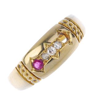 A late 19th century 18ct gold diamond and ruby dress ring. The graduated single-cut diamond line, wi