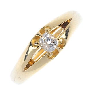 A late Victorian 18ct gold diamond single-stone ring. The old-cut diamond, to the bifurcated scrolli
