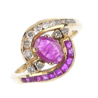 A ruby and diamond dress ring. The oval-shape ruby, with brilliant-cut diamond and calibre-cut ruby