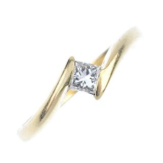 An 18ct gold diamond single-stone ring. The square-shape diamond, to the asymmetric shoulders and pl