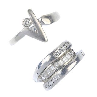Two diamond dress rings. To include a platinum square-shape and brilliant-cut diamond crossover ring