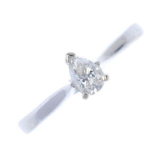 An 18ct gold diamond single-stone ring. The pear-shape diamond, to the tapered shoulders and plain b