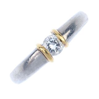 A platinum diamond band ring. The brilliant-cut diamond, to the raised sides and tapered band. Estim