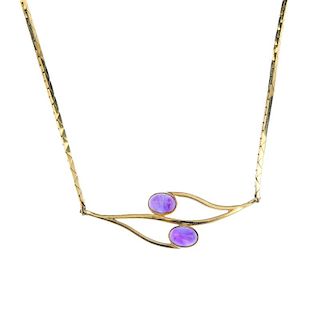 A 9ct gold amethyst necklace and bracelet. The necklace designed as two oval amethyst cabochon colle