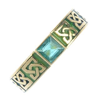 An 18ct gold emerald and enamel dress ring. The square-shape emerald collet, to the green enamel and