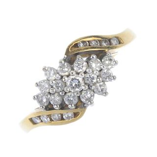 An 18ct gold diamond dress ring. The brilliant-cut diamond cluster, to the similarly-cut diamond asy