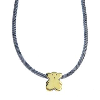 A bear pendant. The stylised bear, suspended from a woven steel chain with yellow metal clasp. Lengt