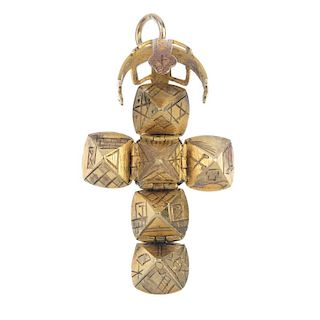 A 9ct gold Masonic ball pendant. The segmented sphere, unfurling to reveal an engraved cross. Hallma