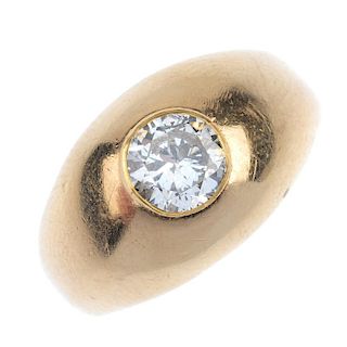 A gentleman's mid 20th century 18ct gold diamond single-stone ring. The circular-cut diamond, inset