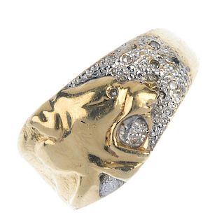 A gentleman's 9ct gold diamond dress ring. The raised panthers head, with pave-set single-cut diamon