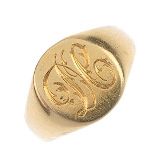 An Edwardian 18ct gold signet ring. The oval-shape monogram panel, to the plain band. Hallmarks for
