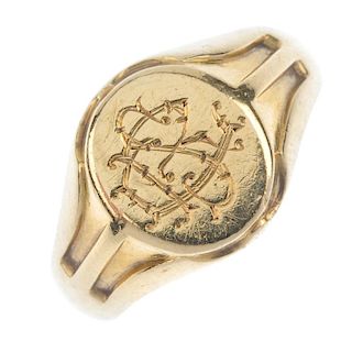 A gentleman's early 20th century 9ct gold signet ring. The oval-shape monogrammed panel, to the groo