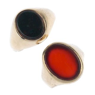 Two mid 20th century 9ct gold gem-set signet rings. Each designed as an oval-shape bloodstone or car