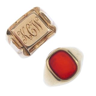 Two gentleman's signet rings. The first designed as a 9ct gold oval-shape carnelian panel, the secon