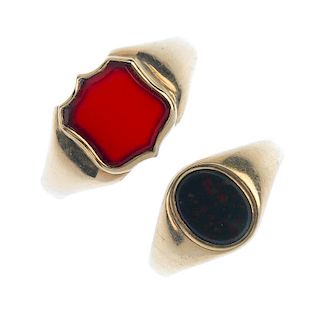 Two 9ct gold hardstone signet rings. The first designed as a shield-shape carnelian panel and collet
