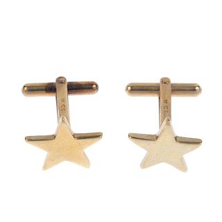 A pair of cufflinks. The star with hinged back fitting. Length of cufflink face 2cms. Weight 5.5gms.