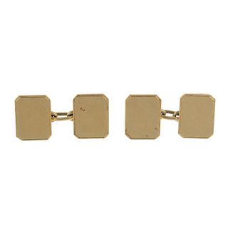 A pair of 1920s 18ct gold cufflinks. Each designed as two rectangular-shape panels, with connecting