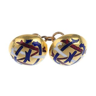 One enamel cufflink. Designed as two circular panels, each with white, blue and red enamel design, t