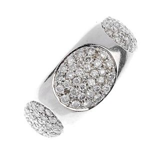 (117589) Two diamond dress rings. The first designed as a pave-set diamond panel to the rectangular