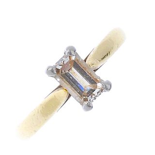 (174110) An 18ct gold diamond single-stone ring. The rectangular-shape diamond, to the tapered shoul
