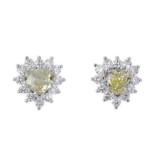 (194424) A pair of 18ct gold coloured diamond and diamond cluster ear studs. Each designed as a hear