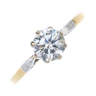 A mid 20th century 18ct gold diamond single-stone ring. The brilliant-cut diamond, to the bi-colour