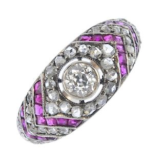 A late 19th century silver and gold, diamond and ruby ring. The old-cut diamond collet, to the rose-