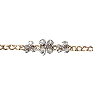 An early 20th century gold diamond clover bracelet. Designed as an old-cut diamond four-leaf clover,