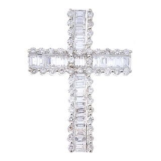 A diamond cross pendant. The baguette-cut diamond cross, within a brilliant-cut diamond border. Esti