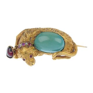 A mid 19th century 18ct gold multi-gem dog brooch. The textured dog, with turquoise body, ruby and d