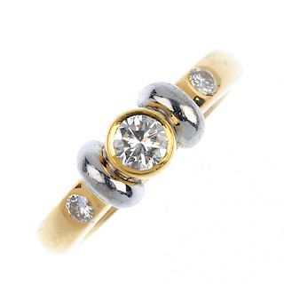 An 18ct gold diamond single-stone ring. Of bi-colour design, the brilliant-cut diamond collet, with