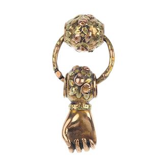 An early 19th century 18ct gold Figa fist pendant. Designed as a suspended clenched fist, to the flo