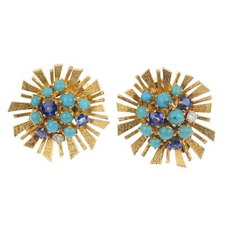 A pair of gem-set ear clips. Each designed as a circular turquoise cabochon, brilliant-cut diamond a