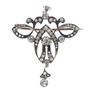 A late 19th century silver and 9ct gold diamond pendant. The three old-cut diamonds, within an old a