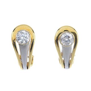 A pair 18ct gold of diamond earrings. Each of bi-colour design, the brilliant-cut diamond collet, to
